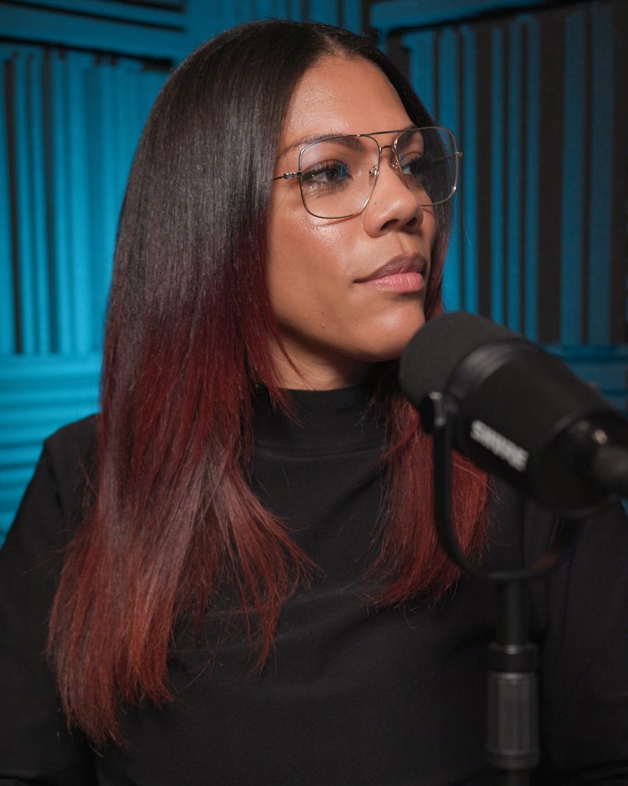 Podcast host at a studio microphone